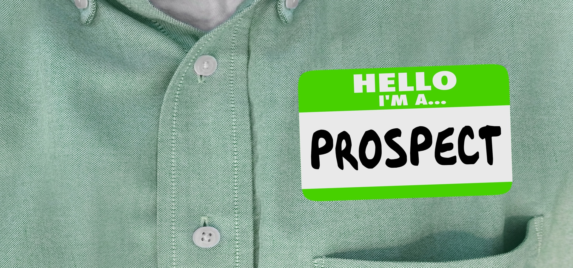 A sticker nametag on a shirt that says "Hello, I'm a Prospect"