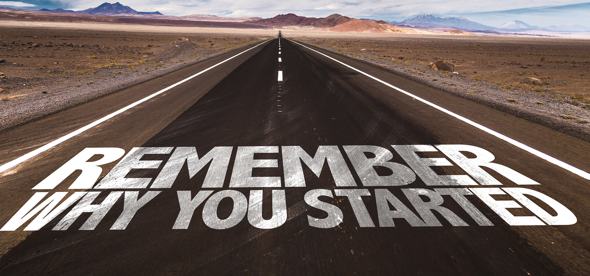 Road with the words "Remember why you started"