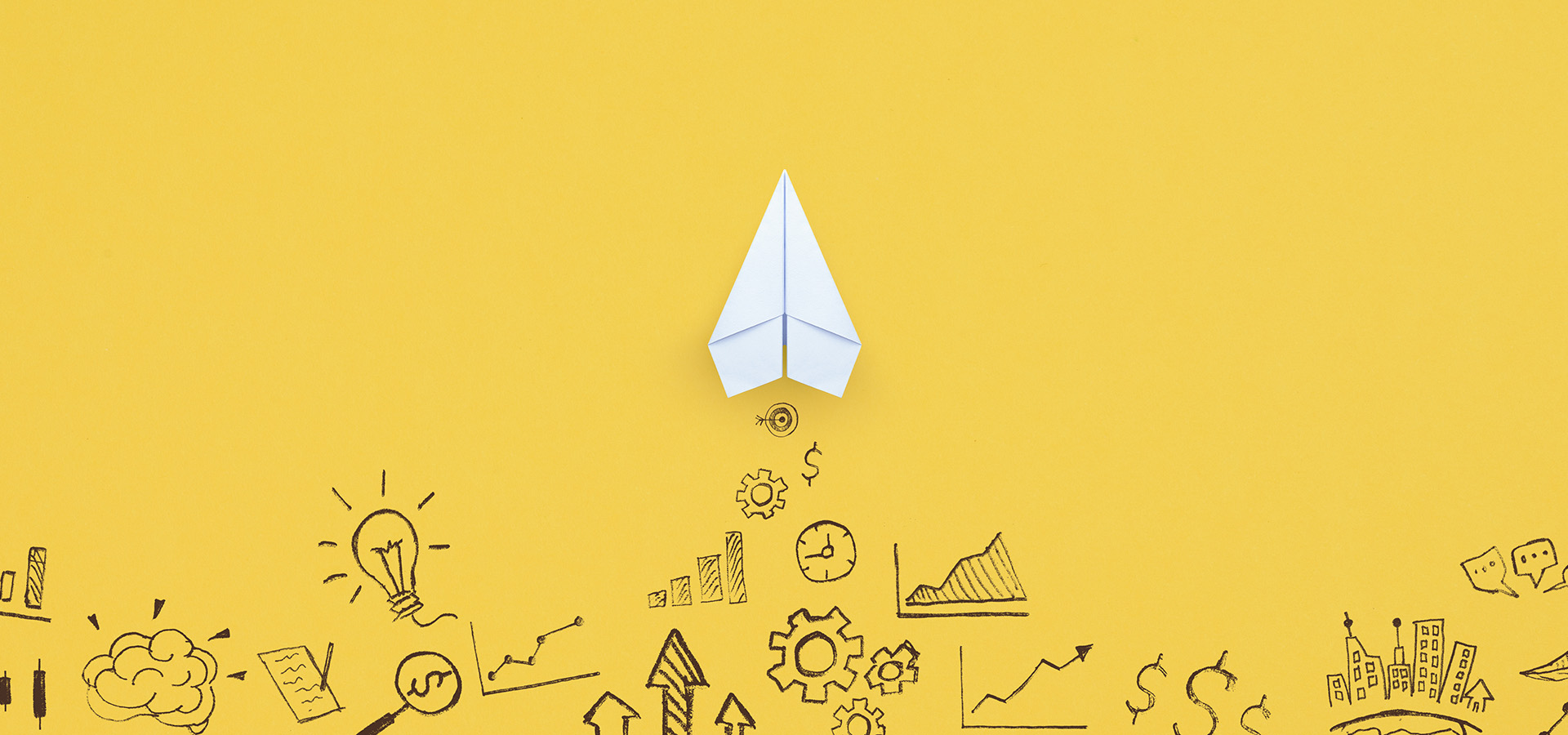 White paper airplane on yellow background